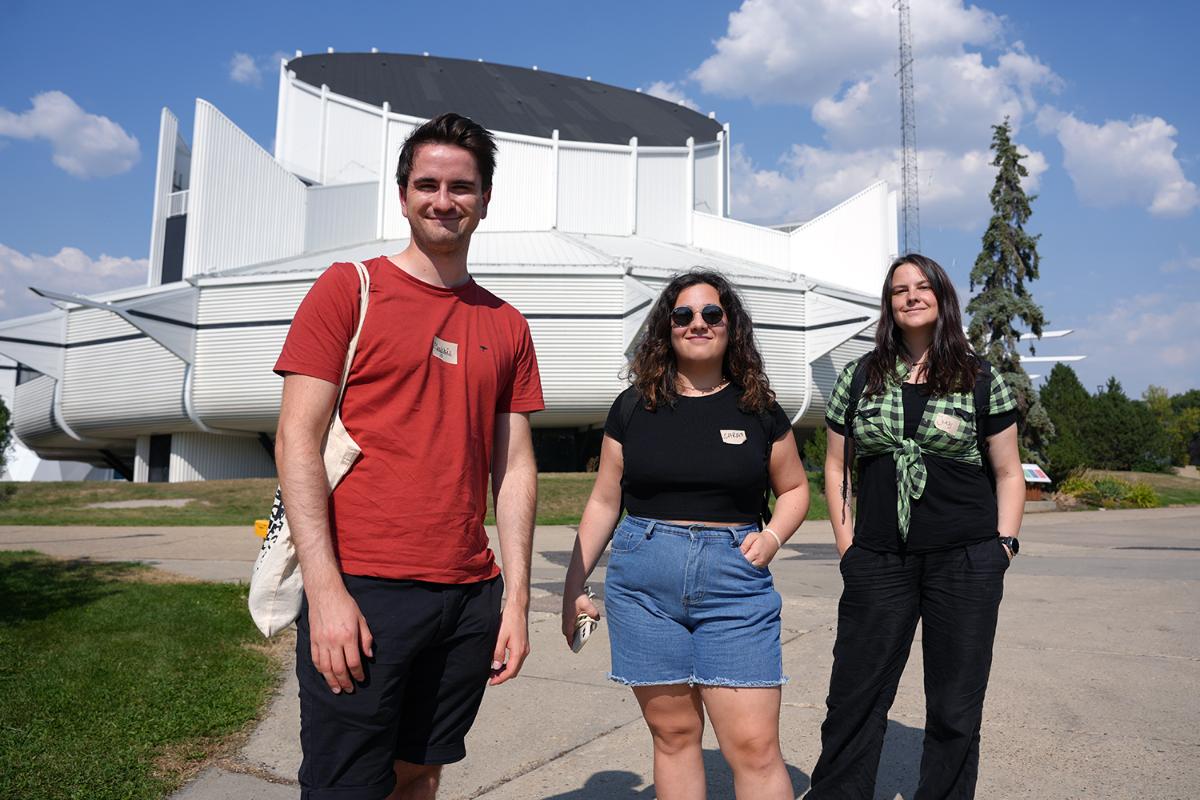 Three persons side by side